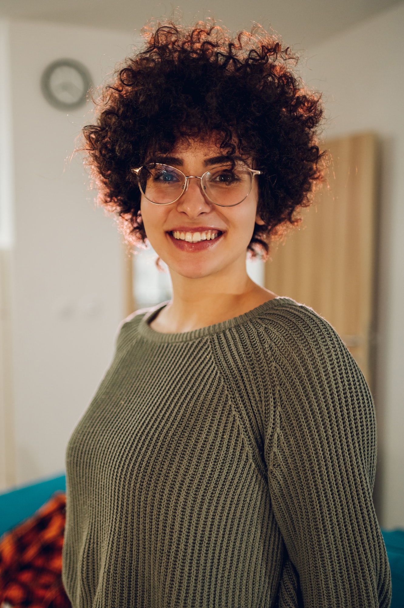 Portrait of a beautiful caucasian woman with afro hairstyle wearing eyeglasses